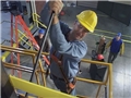 Maintenance workers using safe work procedures to reduce the chance of getting injured while at work